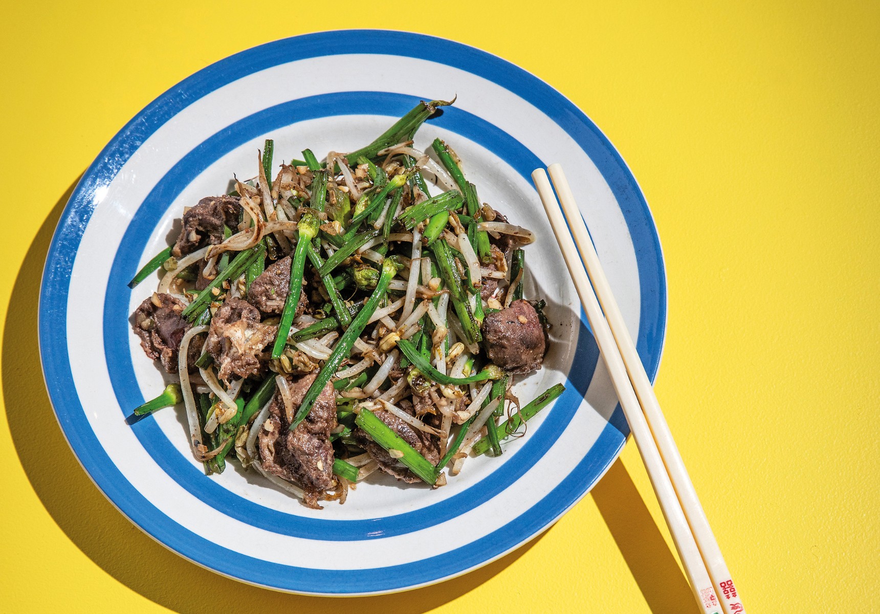 Viet Kieu's stir-fried livers with flowering garlic. Photo: courtesy Murdoch Books
